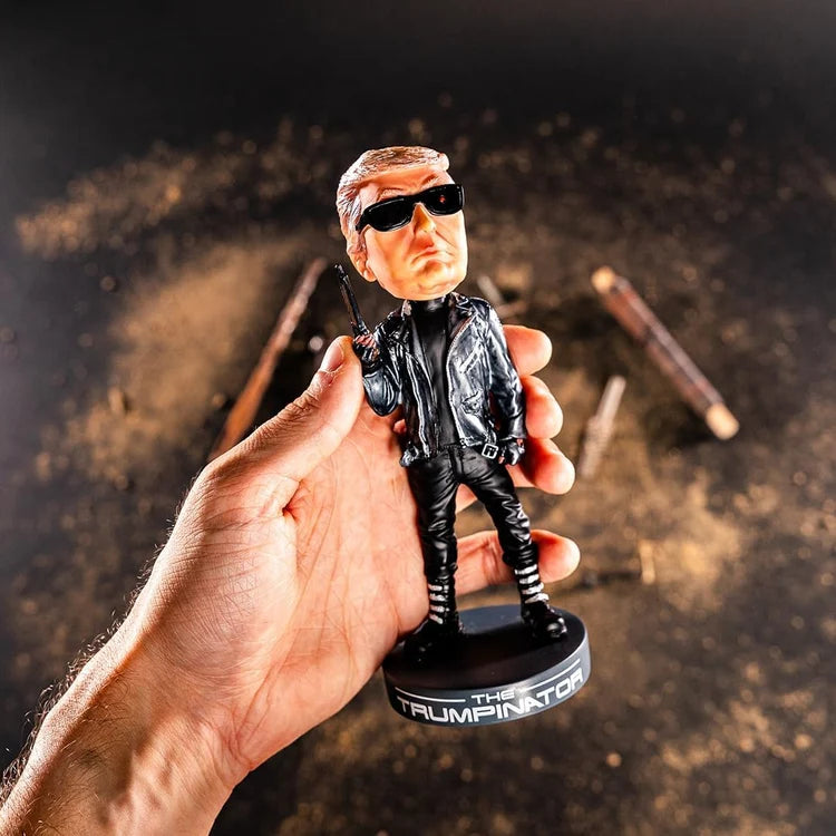 Hand holding the Trumpinator Bobblehead close-up