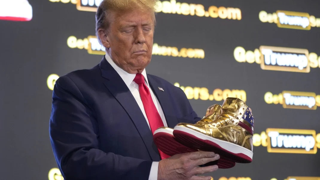 Donald Trump holding Never Surrender sneaker