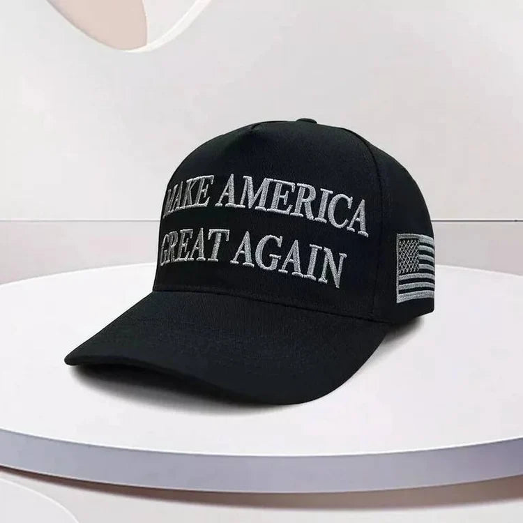 Dark MAGA Blackout Edition cap on a white pedestal